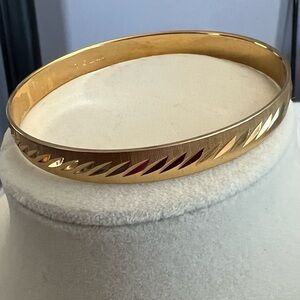 Vintage Monet L Etched Gold Tone Textured Bangle Bracelet